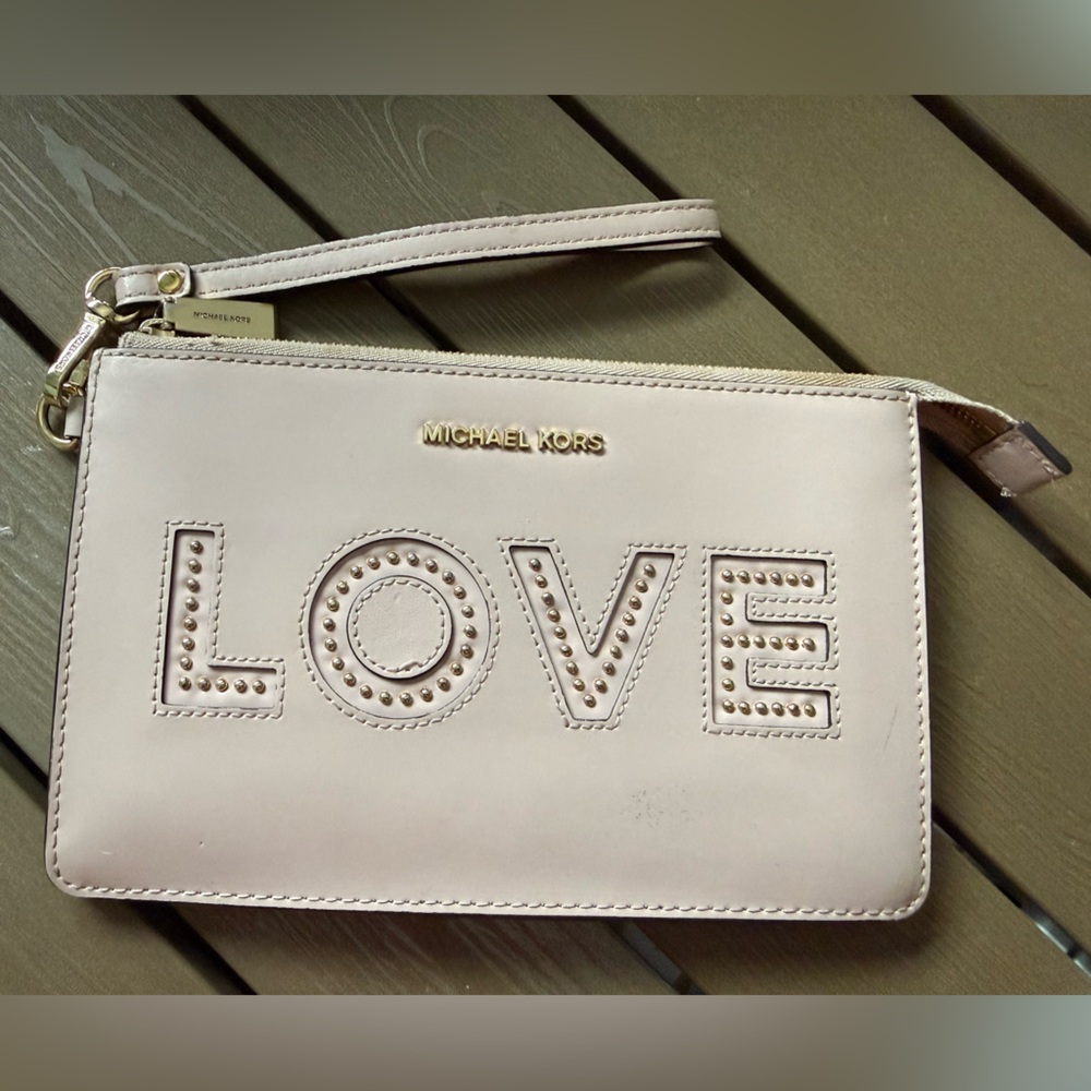 Michael Kors Love Embossed Wristlet in pale pink